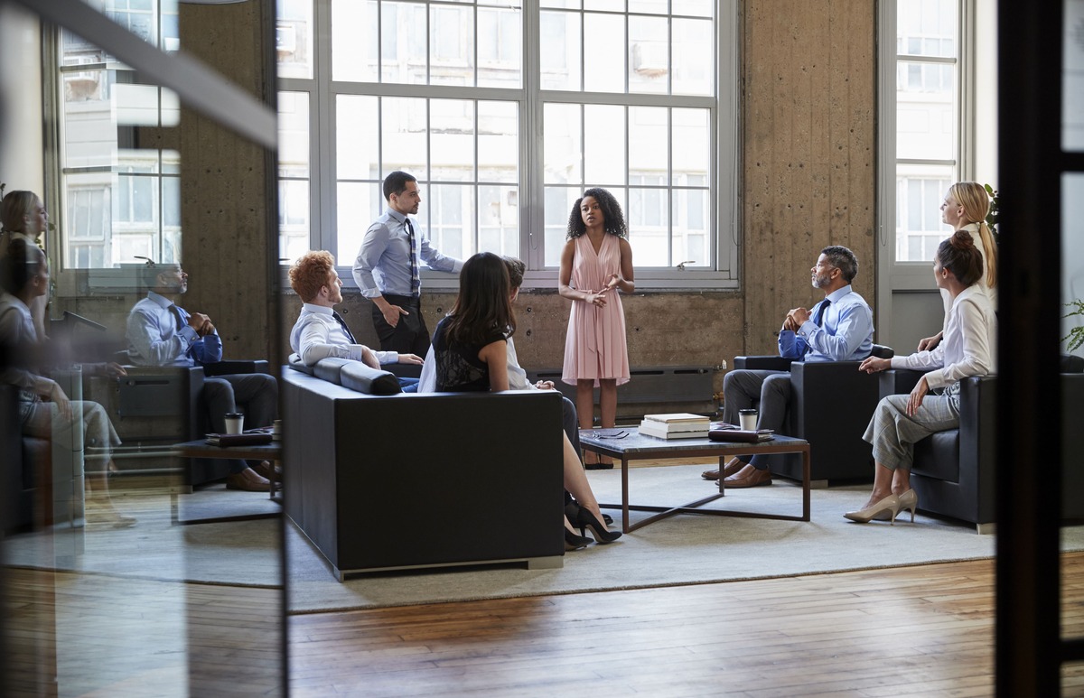 corporate-presentation-by-woman-to-coworkers-at-of-2026-01-05-22-46-26-utc