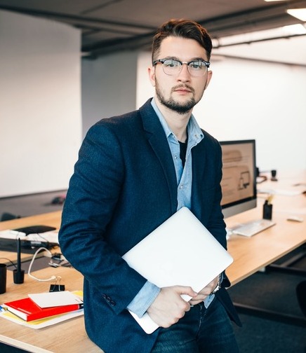 young-attractive-man-in-glassess-is-standing